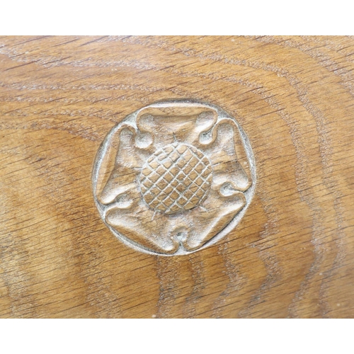 1047 - Yorkshire Oak  - a childs oak chair, panel back carved with a Yorkshire Rose, brass nail upholstered... 