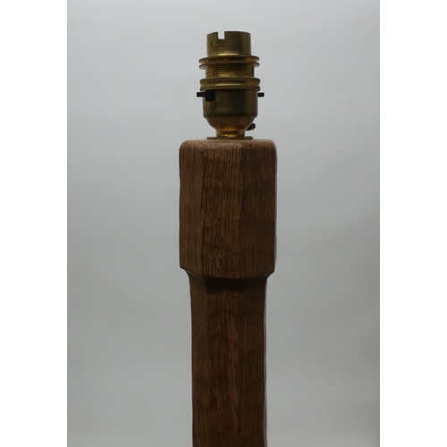 1005 - Robert Mouseman Thompson - an oak standard lamp, adzed octagonal tapering column on stepped base, ca... 