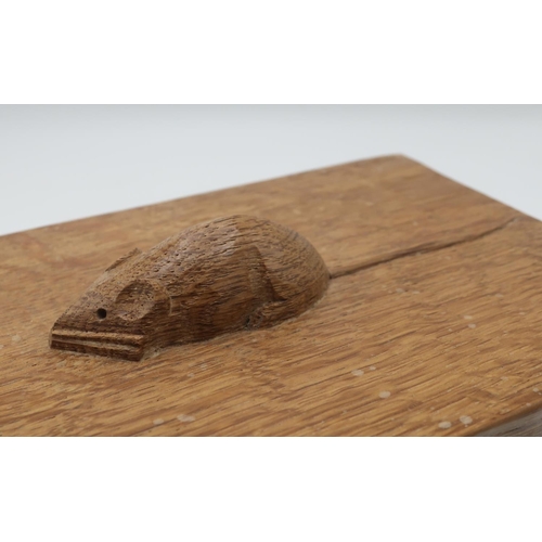 1008 - Robert Mouseman Thompson - a rectangular adzed oak trinket box, the cover with mouse handle W18cm D1... 