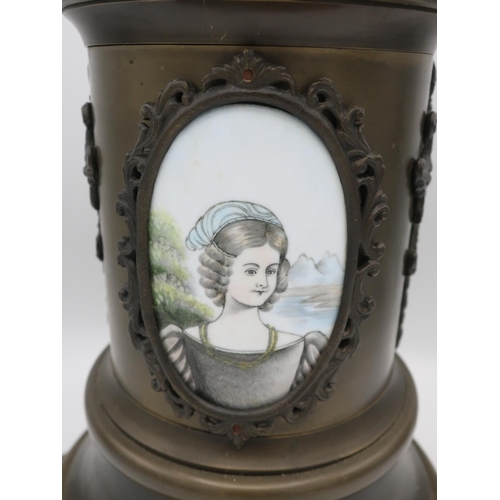 1269 - French style mantle timepiece, patinated cylindrical column with painted porcelain panels and applie... 