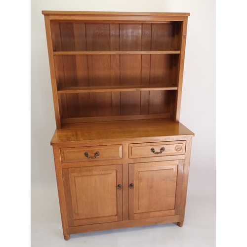 1059 - Andrew Conning Butterfly Furniture - an oak dresser with twin shelf back, the base with panelled dra... 