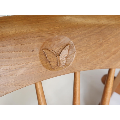 1057 - Andrew Conning Butterfly Furniture - an oak dining table, rectangular top with rounded ends on solid... 