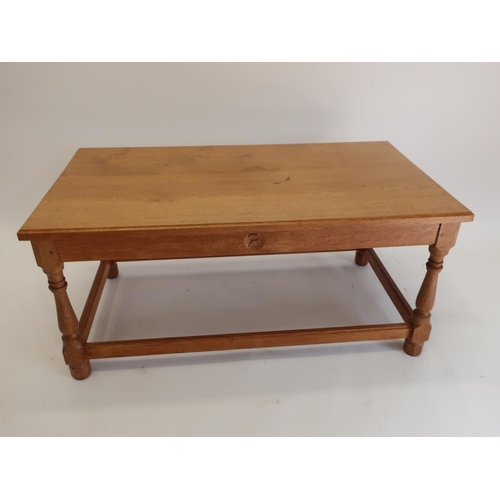 1064 - Andrew Conning Butterfly Furniture - an oak coffee table, with moulded rectangular top on baluster t... 