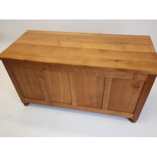 1065 - Andrew Conning Butterfly Furniture - a panelled oak rectangular blanket box, hinged top with canted ... 