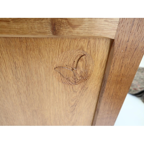 1065 - Andrew Conning Butterfly Furniture - a panelled oak rectangular blanket box, hinged top with canted ... 