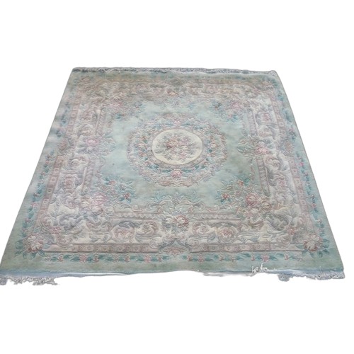 1328 - Chinese embossed woollen washed rug, green ground  floral central patterned medallion, rose floral b... 