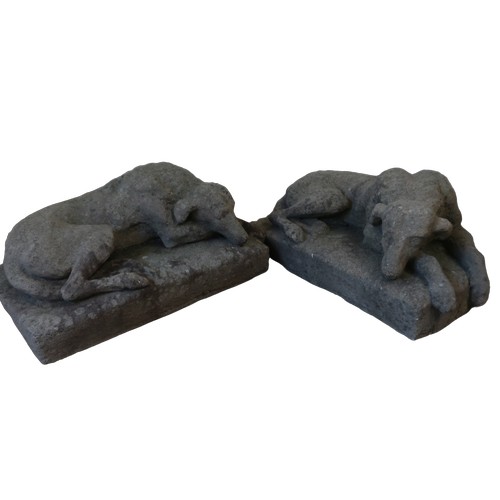 1360 - After Landseer, a pair of mid-century reconstituted stone models of recumbent hounds, L80cm D50cm H3... 