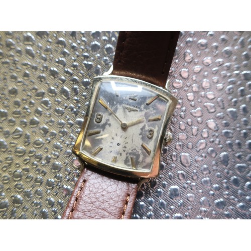 1122 - Longines mechanical wristwatch, rectangular wristed 10K gold filled case on leather strap. Snap on c... 