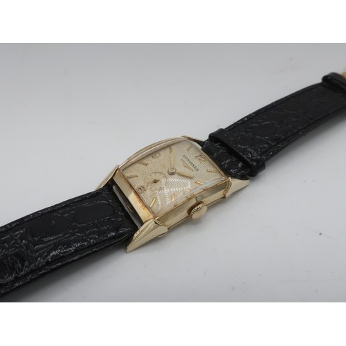 1121 - Longines mechanical wristwatch, rectangular curved 10K gold filled case, shaped lugs on leather stra... 