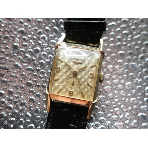 1121 - Longines mechanical wristwatch, rectangular curved 10K gold filled case, shaped lugs on leather stra... 
