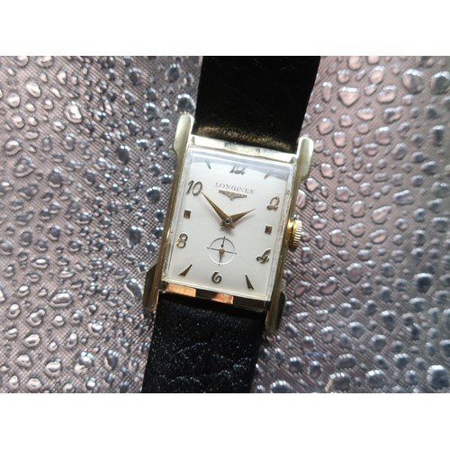 1119 - Longines mechanical wristwatch, rectangular curved and shaped 19K gold filled case on leather strap,... 
