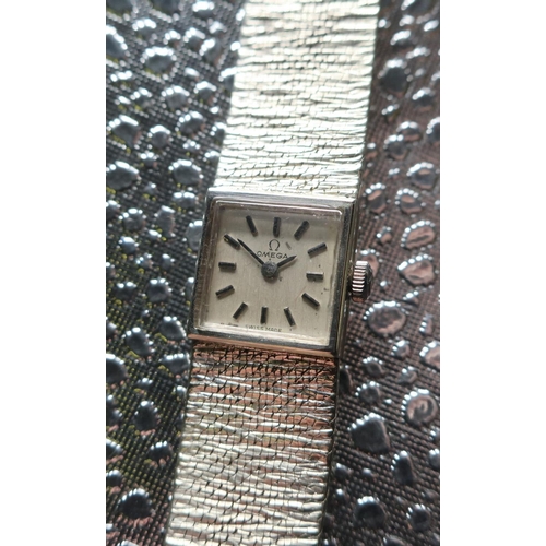1134 - Ladies Omega 9ct white gold cocktail watch, integral bark effect bracelet stamped .375, snap on case... 