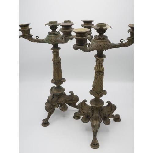 1246 - Pair of Regency gilt bronze candleabra, three scroll branches with leaf cast sconces on anthemion co... 