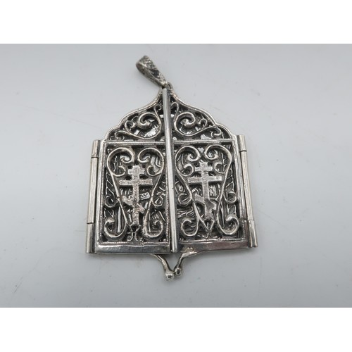 1106 - Russian silver travelling Icon pendant, with Madonna and child in relief enclosed by two pierced pan... 