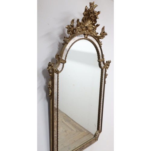 1342 - Pair of Venetian style giltwood pier mirrors, segmented arched plates with shell and scroll cresting... 