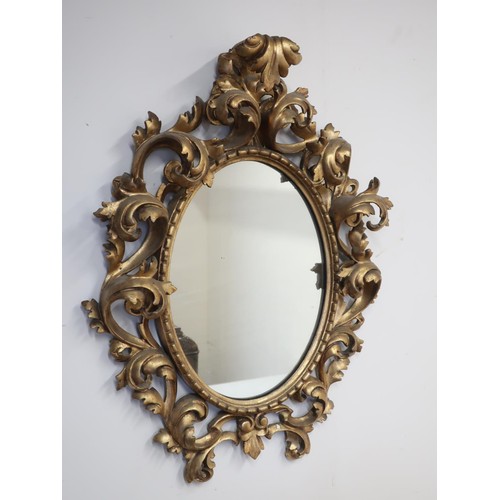 1341 - 18th century Florentine style giltwood wall mirror, with oval plate in C scroll and acanthus openwor... 