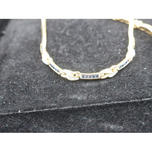 1137 - 18K gold collar necklace, set with alternate sapphire and diamond links, L41cm and a matching bracel... 