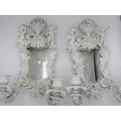 1240 - Set of four 19th Century Meissen blanc de chine porcelain two branch sconces, shaped plates in flora... 