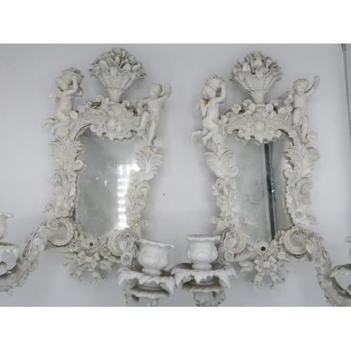 1240 - Set of four 19th Century Meissen blanc de chine porcelain two branch sconces, shaped plates in flora... 