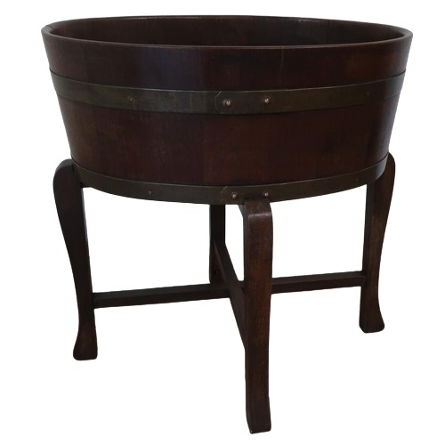 1306 - Edwardian coopered mahogany oval jardiniere, with two brass bands and tin liner, on four angular sup... 