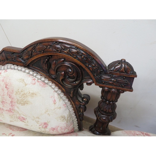 1348 - Victorian mahogany chaise longue, frame carved with flowers and scrolls, on turned tapering supports... 
