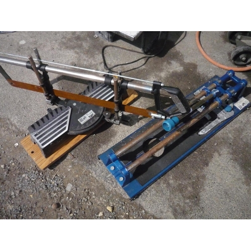 79 - Manual tile cutter and a hand saw