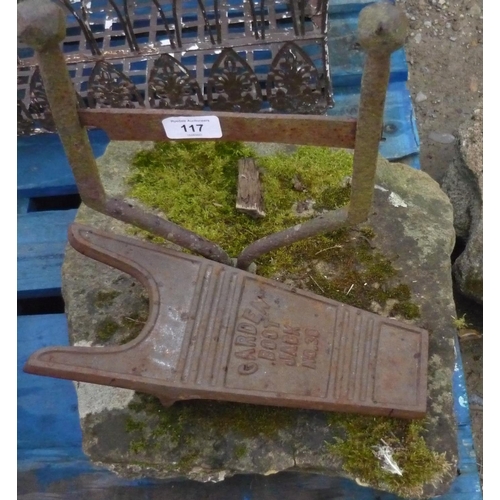 117 - Iron boot scraper mounted in stone and an iron garden boot jack No.38