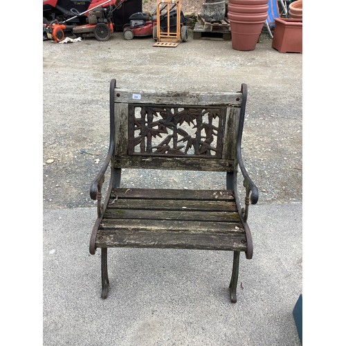 295 - Ornate single garden bench with scroll arms with exotic back panel with bamboo and parrots