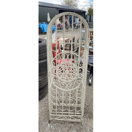 296 - Cream painted metal free standing wine rack With scroll detail and door (45 bottles)