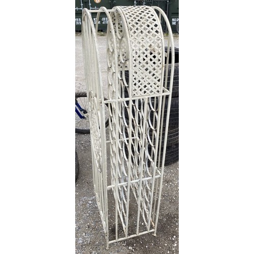 296 - Cream painted metal free standing wine rack With scroll detail and door (45 bottles)