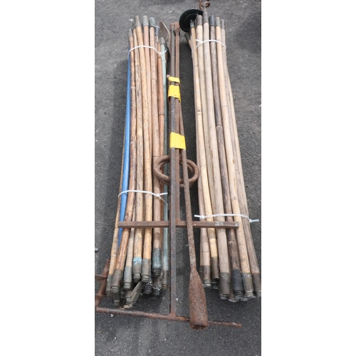 318 - Large collection of drainage rods with drain cover keys