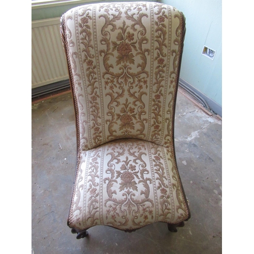 176 - Victorian walnut framed nursing chair with serpentine upholstered seat and back on moulded cabriole ... 