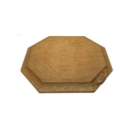 1073 - Robert Mouseman Thompson - an adzed oak bread board, carved with signature mouse, W30.5cm D25cm