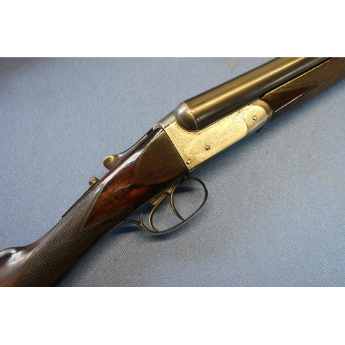 18 - Unnamed 12 bore side by side shotgun with 28 inch barrels and 15 1/4 inch straight through stock, se... 