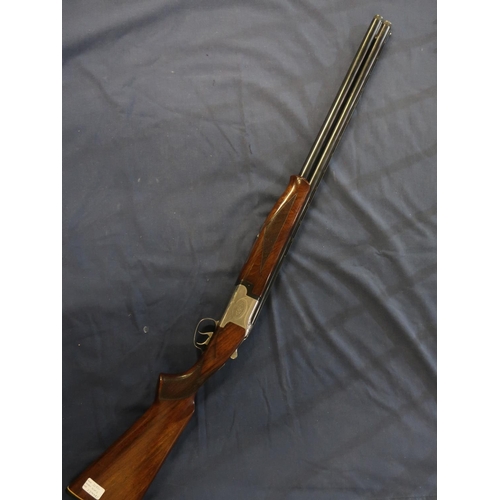 23 - Larona 12 bore over and under ejector shotgun with 28inch adjustable choke barrel and 14 3/4 inch pi... 