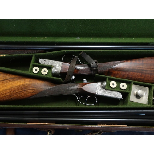 10 - Leather cased pair of William Ford 12 bore side by side boxed ejector shotguns with 26 inch barrels ... 