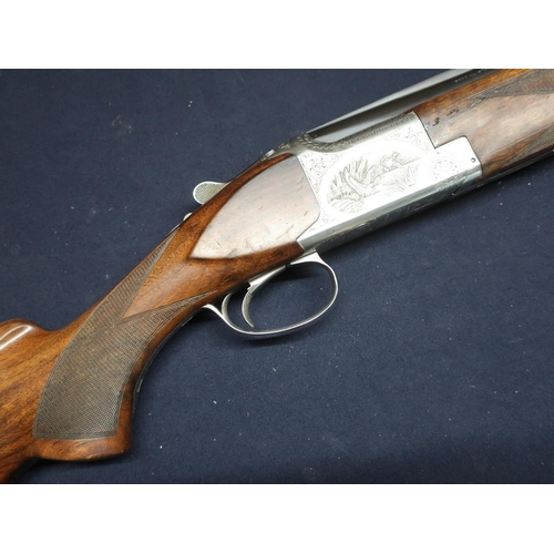 27 - Browning B2G Arms Company Morgan, Utah and Montreal, 12B over and under single trigger ejector shotg... 