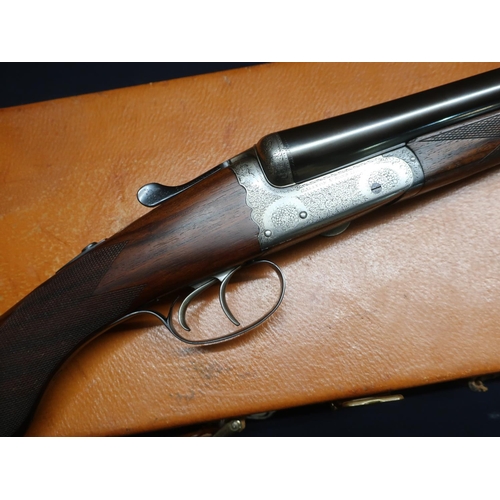 8 - Tan leather cased Gallyon & Sons. 12 bore side by side round action ejector shotgun with 28 inch bar... 