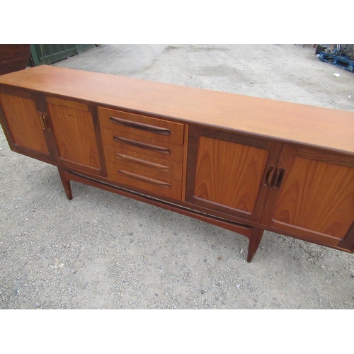 365 - G-Plan teak sideboard, four central drawers enclosed by four panelled doors on square tapered suppor... 