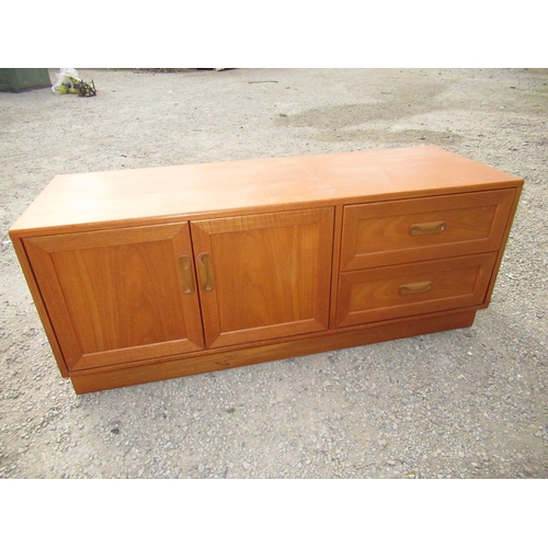 377 - G-plan teak entertainment unit with two drawers and a pair of doors on plinth base W.131cm D.36cm H.... 