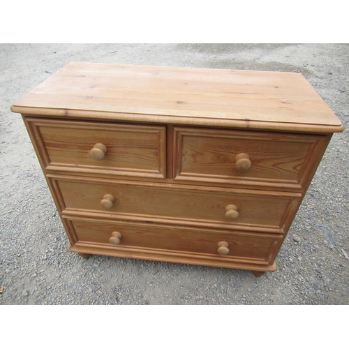 378 - Pine chest of two short and two long moulded drawers with turned wooden handles and feet W.90cm D.43... 