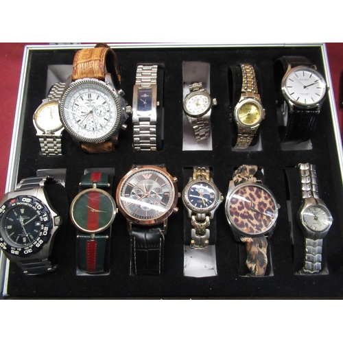 480 - Twelve quartz fashion watches in aluminum display case