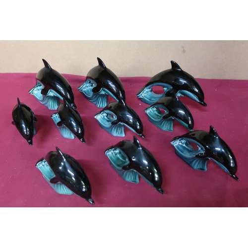 74 - Poole Pottery dolphin figurines, three large and seven small (10)