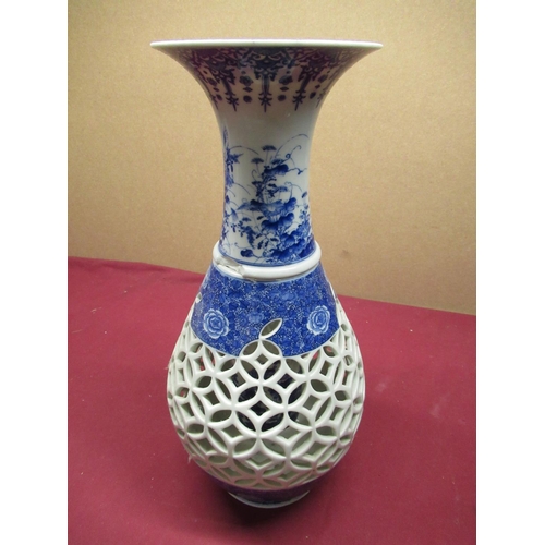 219 - 20th century oriental two-section vase of baluster form, pierced open fret work design, blue and whi... 