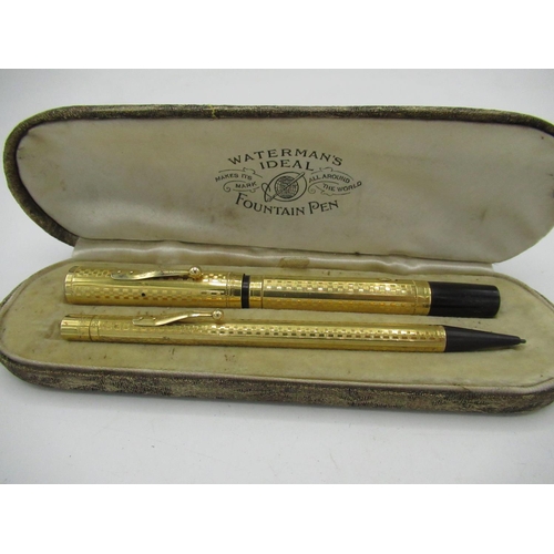 221 - Waterman's cased fountain pen and propelling pencil set, black Bakelite and rolled gold body with al... 