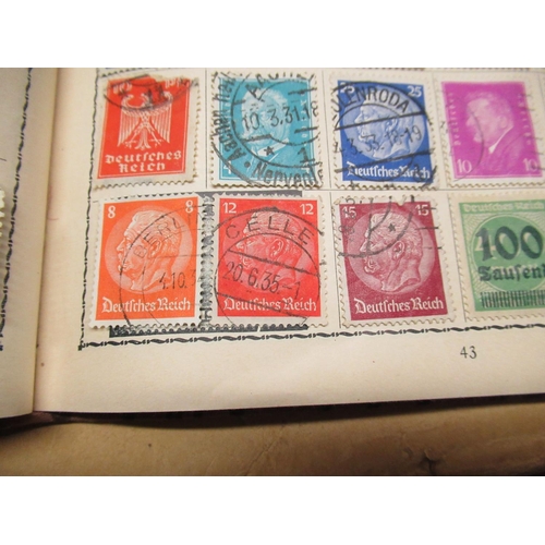 447 - Small stamp album containing a small collection of stamps including Canada France, French colonies, ... 