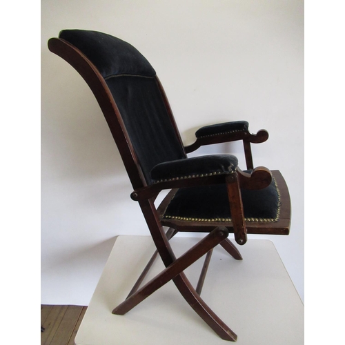 530 - An Edwardian mahogany framed folding armchair upholstered seat back and arms