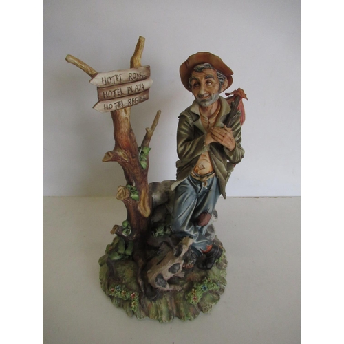 202 - Capodimonte figure of a travelling vagabond with sign on tree H34cm