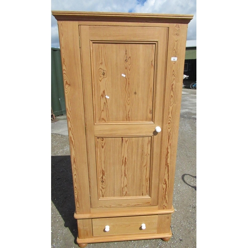 526 - Waxed pine wardrobe with single door and drawer to base W86cm D54cm H185cm