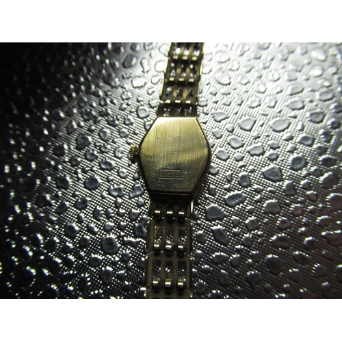 64 - Ladys Accurist Diamond quartz wrist watch. 9ct gold case on integral bracelet stamped .375 snap on b... 